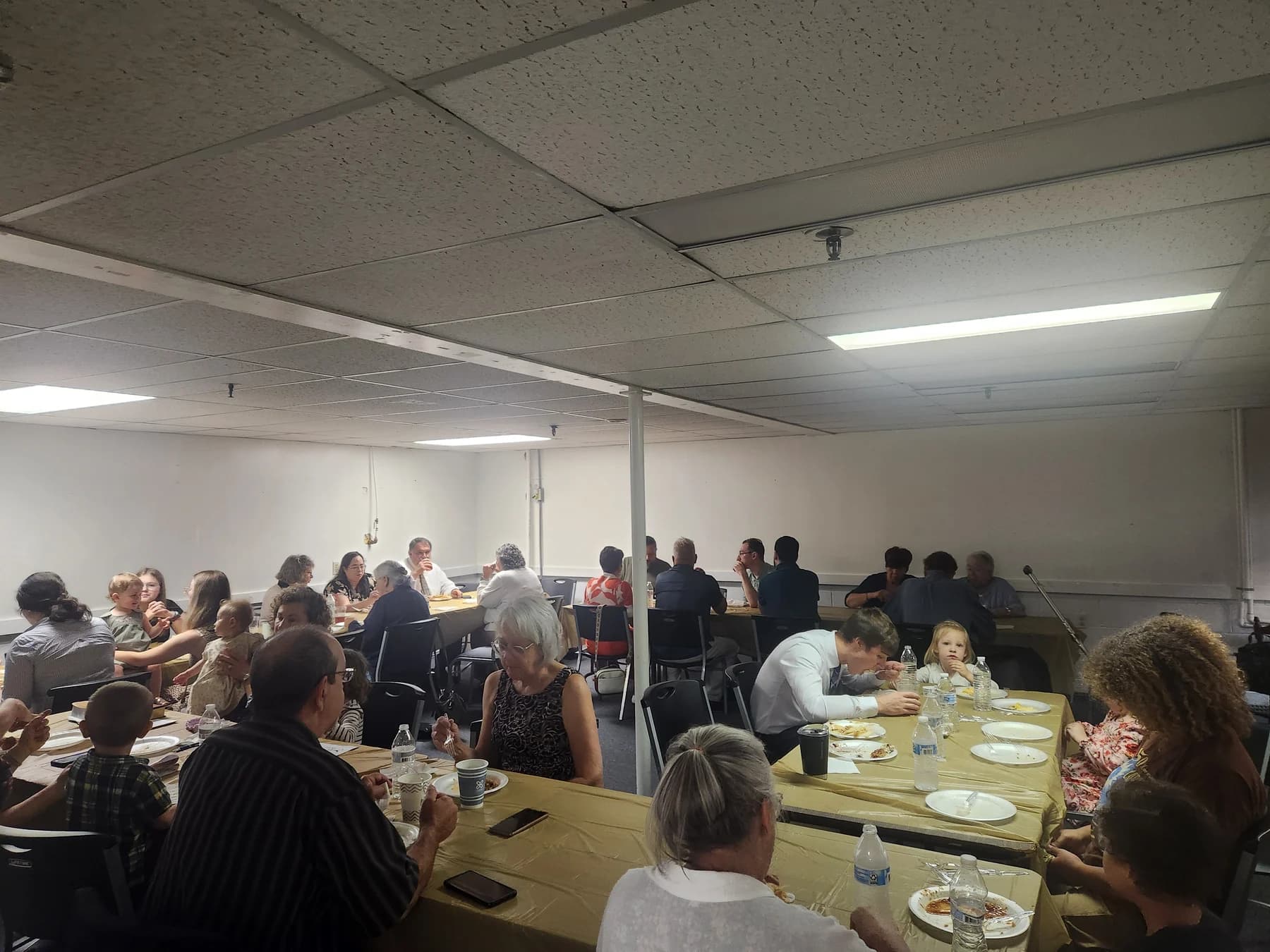 Lighthouse families sharing a fellowship meal